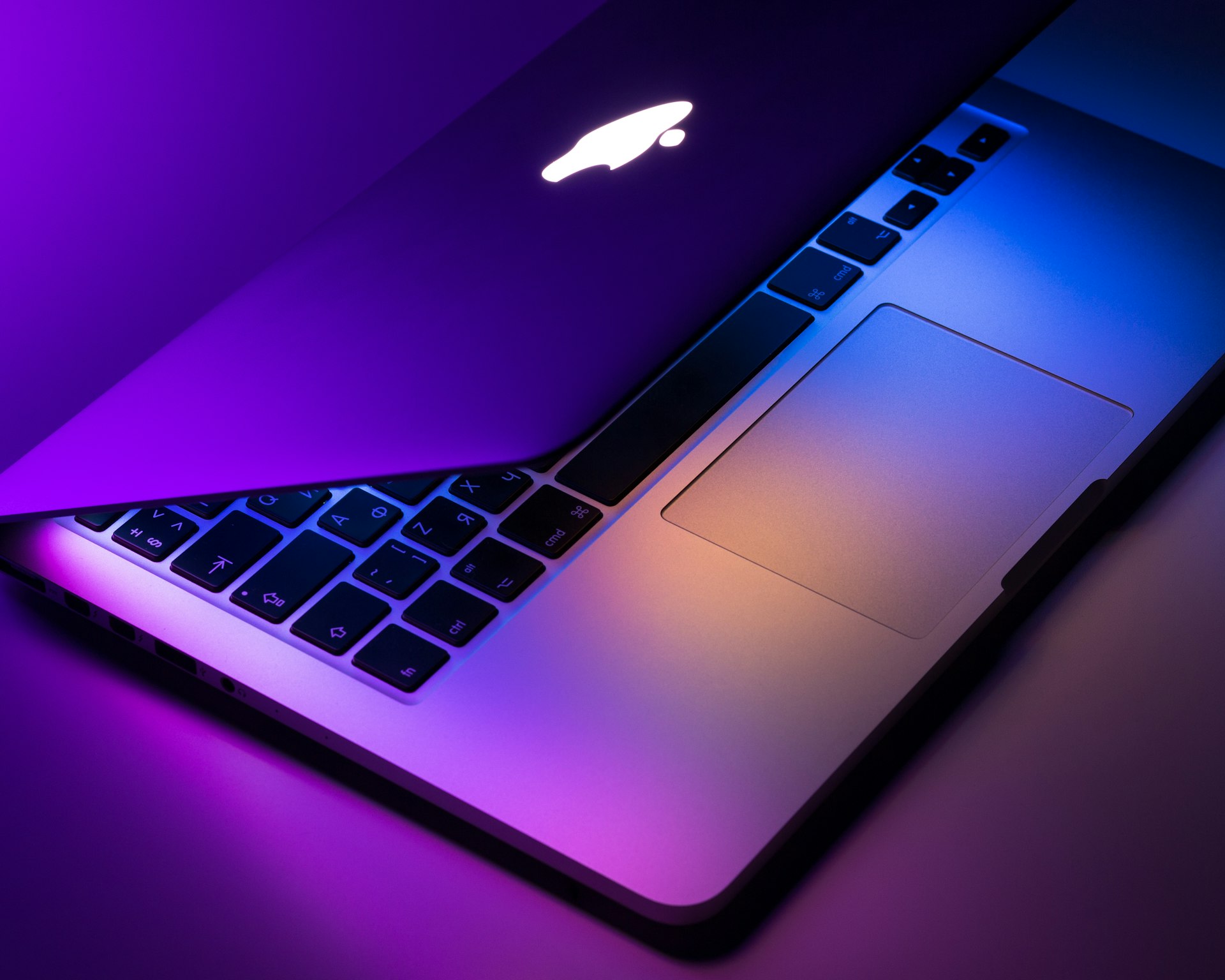 Creative professional working on Mac Pro in a design studio with multiple displays